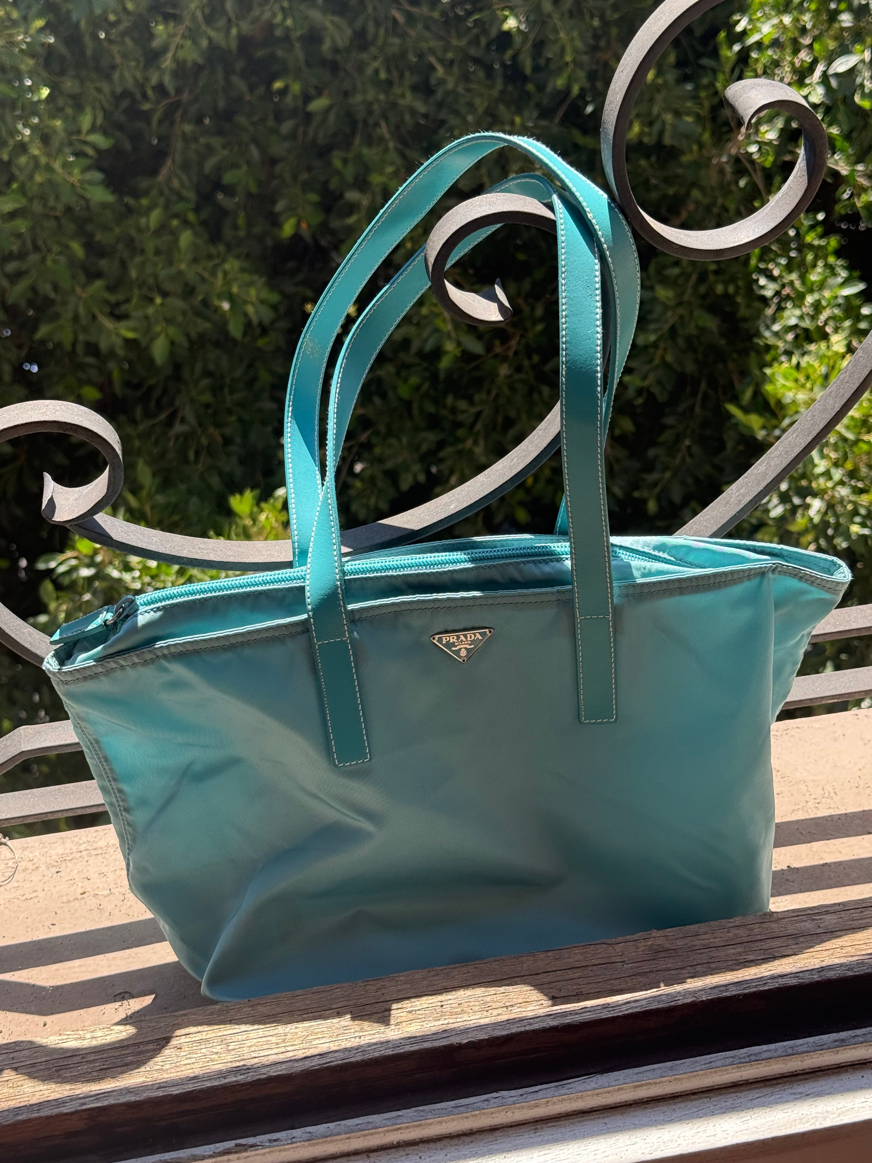 Prada teal vela bag
